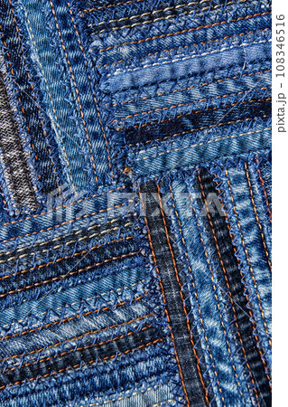 Diagonal denim fabric pattern in patchwork style. Diagonal denim fabric pattern in patchwork style. 108346516