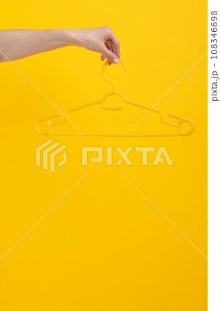 Hanger isolated on yellow background Hanger isolated on yellow background 108346698