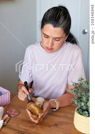 Creative woman painting handmade doll face. Creative woman painting handmade doll face. 108346948