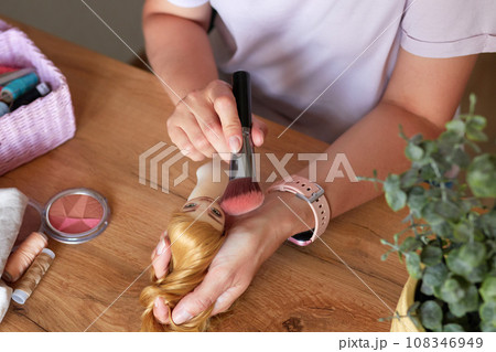 Creative woman painting handmade doll face. Creative woman painting handmade doll face. 108346949