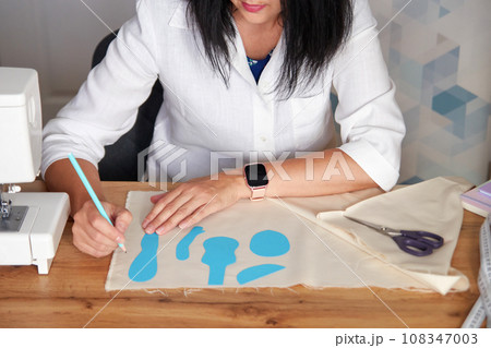 Creative woman working on sewing patterns. 108347003