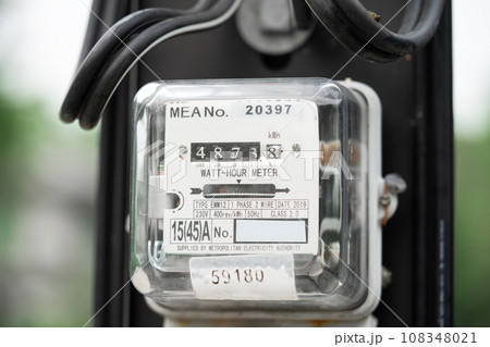 Bangkok, Thailand April 10, 2023,Electric measuring power meter for energy cost at home and office. Bangkok, Thailand April 10, 2023,Electric measuring power meter for energy cost at home and office. 108348021