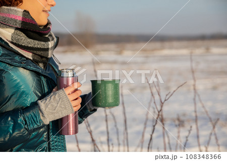 Thermal mugs keep your drink warm for hours. 108348366