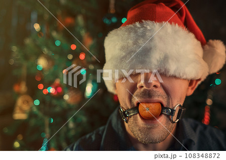 Happy man calling friends for Christmas using his phone Happy man calling friends for Christmas using his phone 108348872