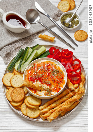 Hot Pepper Jelly Cheese Dip with crackers, veggies 108348907
