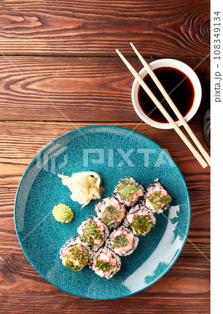 Sushi rolls with shrimps and parsley chips. 108349134