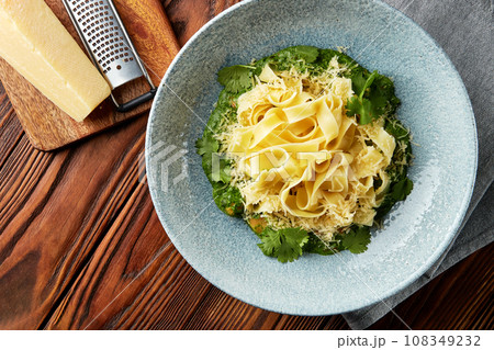 Fettuccine pasta with pesto sauce. Fettuccine pasta with pesto sauce. 108349232