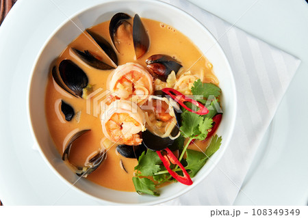 Spicy Thai soup Tom Yam with seafoods. Spicy Thai soup Tom Yam with seafoods. 108349349