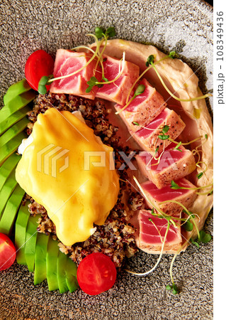 Quinoa with tuna, hummus, egg and vegetables 108349436