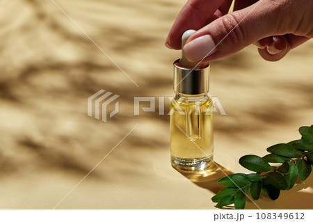Spa cosmetics, oil for facial massage in glass bottle. Spa cosmetics, oil for facial massage in glass bottle. 108349612