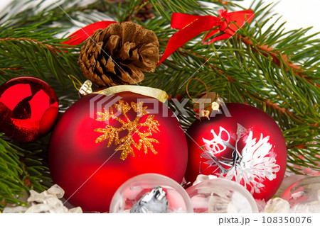 Christmas decorations. Christmas 2023 2024. Big set of Christmas fir garlands with berries and red cones. Close the balls on the Christmas tree. Bokeh grains in the background. New Year concept. 108350076