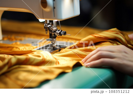 sewing machine scribbling fabric. tailoring at the factory. 108351212