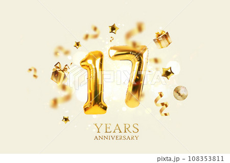 Gold festive balloons 17 years anniversary with golden confetti, presents, mirror ball and stars fly on a beige background with bokeh lights and sparks. Birthday luxury seventeen card, a creative idea Gold festive balloons 17 years anniversary with golden confetti, presents, mirror ball and stars fly on a beige background with bokeh lights and sparks. Birthday luxury seventeen card, a creative idea 108353811