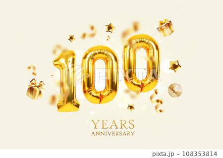 Gold Balloons 100 with golden gifts, confetti, stars and a mirrored balloon on a beige background with sparkles and bokeh lights. One hundred years Anniversary, creative idea. Luxury Card 108353814