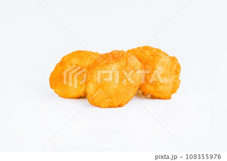 Breaded Chicken Inner Fillet on a White Background,Chicken Breaded Raw Meat.Chicken Breaded Fillet. Breaded chicken nuggets. Fast homemade food at home. Chicken breaded schnitzels. Fast cooking. 108355976