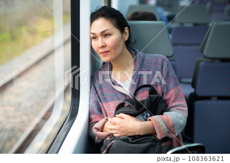 Portrait of woman traveling in urban trai 108363621
