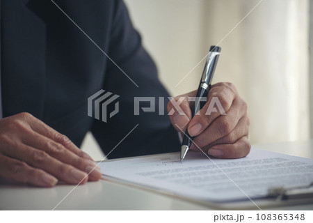 Asian business man using pen signing on new contract to starting projects in conference room. Close up manager businessman hands sign contract working meeting. Business agreement concepts. Asian business man using pen signing on new contract to starting projects in conference room. Close up manager businessman hands sign contract working meeting. Business agreement concepts. 108365348