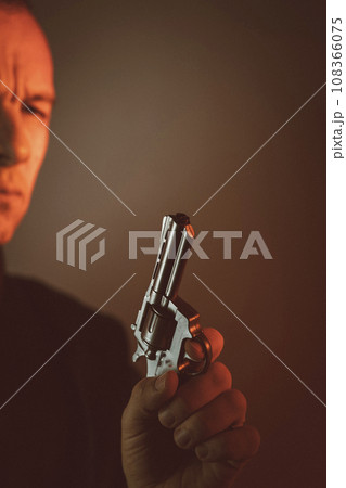 Gunman killer holding pistol artistic photo 108366075