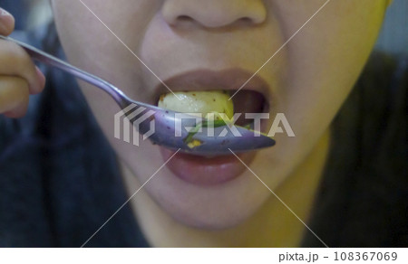 Woman eating pork meatballs, Woman eating pork meatballs, 108367069