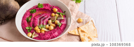 Homemade Beetroot hummus on white table, copy space Homemade Beetroot hummus on white table, copy space 108369368