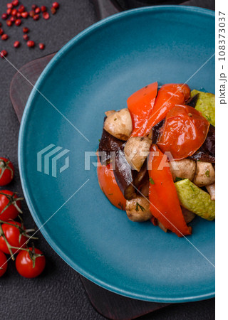 Delicious salad of grilled vegetables tomatoes, mushrooms, sweet peppers, eggplants 108373037