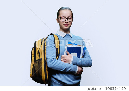 Portrait of teenage girl high school student on white background 108374190