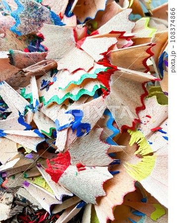 shavings and pieces of lead on paper after sharpening pencils, preparing pencils for use in teaching and drawing 108374866