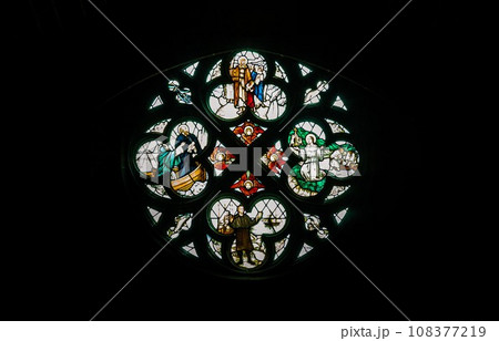 Silhouette of Stained glass window, Pattern of Medieval gothic rose window in Liverpool cathedral. Silhouette of Stained glass window, Pattern of Medieval gothic rose window in Liverpool cathedral. 108377219