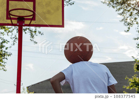 Ball Head, Heart Full: Young Player Embraces Unique Perspective on the Basketball Court Ball Head, Heart Full: Young Player Embraces Unique Perspective on the Basketball Court 108377545