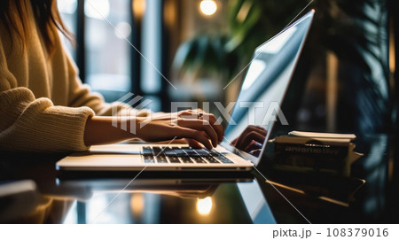 Hands of a programmer working on a laptop in the office, programming or ordering goods online 108379016