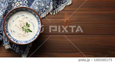 Flat lay of yogurt soup on tablecloth on old wooden table with copy space for text. Traditional soups of Turkish cuisine, travel blog about cooking of peoples of the world, delicious and healthy food 108380173