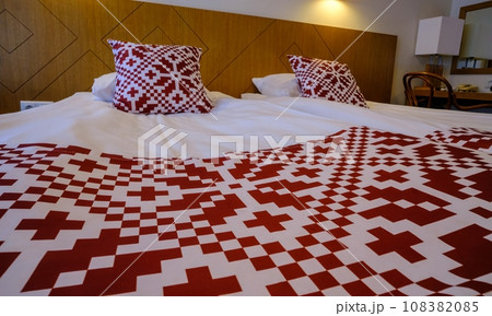 Recreation area in the hotel. Bed linen with red national symbols of Estonia 108382085