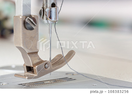 Sewing machine needle with thread and fabric Sewing machine needle with thread and fabric 108383256