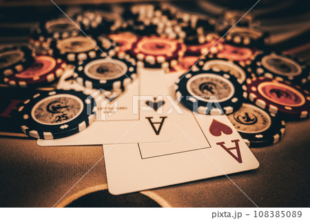 Dealer or croupier shuffles poker cards in a casino on the background of a table, chips. Concept of poker game, game business. Playing for money, a big win, a jackpot, gambling, a desire to get rich. Dealer or croupier shuffles poker cards in a casino on the background of a table, chips. Concept of poker game, game business. Playing for money, a big win, a jackpot, gambling, a desire to get rich. 108385089