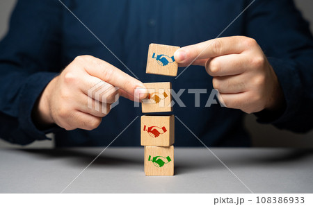 The mediator helps close the deal. Set dialogue of opponents. Sign the contract. Come to a consensus. Cooperation instead of competition. Mediation between sides. Reaching an agreement. 108386933