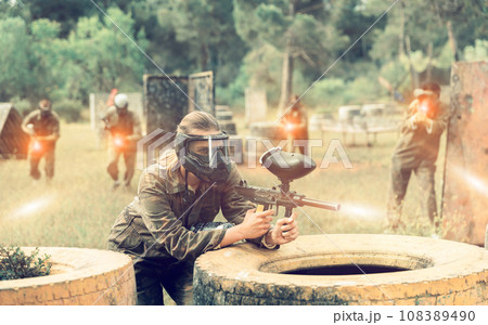 Team of friends paintball players playing together in battle 108389490