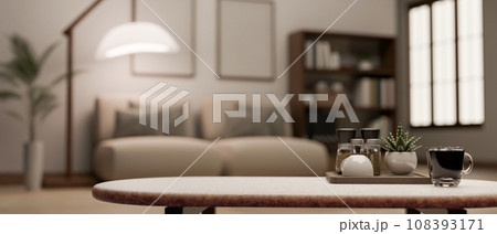 Copy space on a coffee table in a modern and cosy living room. blurry background. 108393171