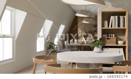 A beautiful, cosy office lounge or co-working space with a table. Empty mockup space on a table. 108393174