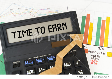 On the business charts there is a calculator on the screen with the inscription - Time to Earn On the business charts there is a calculator on the screen with the inscription - Time to Earn 108398287