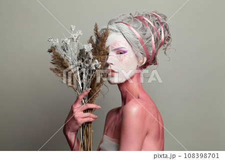 Fashion portrait of funny young woman with stage makeup and hairstyle. 108398701