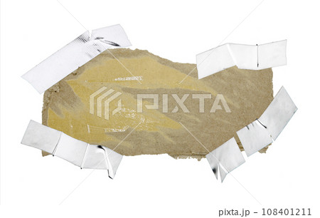 A sheet of corrugated paper is torn into pieces isolated on white background A sheet of corrugated paper is torn into pieces isolated on white background 108401211