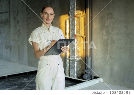 Designer builder with design project inspecting apartment, checks process renovation in new house 108402398