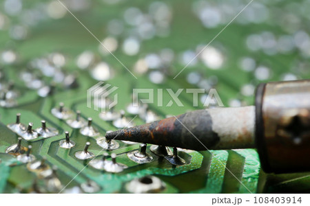 Television motherboard with soldering iron 108403914