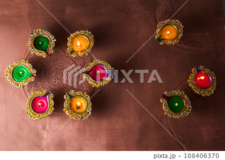 Burning diya on Happy Diwali, background for light festival of India Burning diya on Happy Diwali, background for light festival of India 108406370