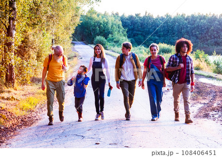 Golden Bonds: Diverse Friends Stroll by Forest Lake at Sunset Golden Bonds: Diverse Friends Stroll by Forest Lake at Sunset 108406451