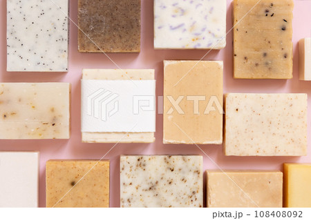 Beige and brown handmade soap bars on light pink top view, soap packaging mockup 108408092