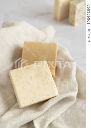 Beige handmade soap bars on cream linen towel close up Beige handmade soap bars on cream linen towel close up 108408099