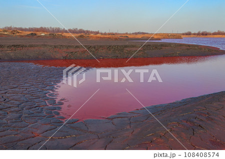Technical settler of industrial water of mining industry in Kryvyi Rih, Ukraine. Red water polluted with iron ore waste 108408574