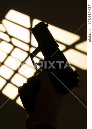 Man shooting pistol gun 108410437