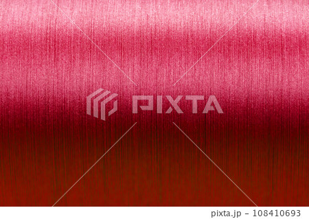 Closed up of red color of thread textured background (Focus at center of picture) 108410693